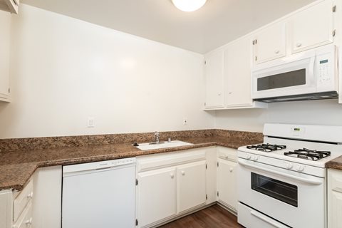 Kitchen with White Appliances and White Cabinets